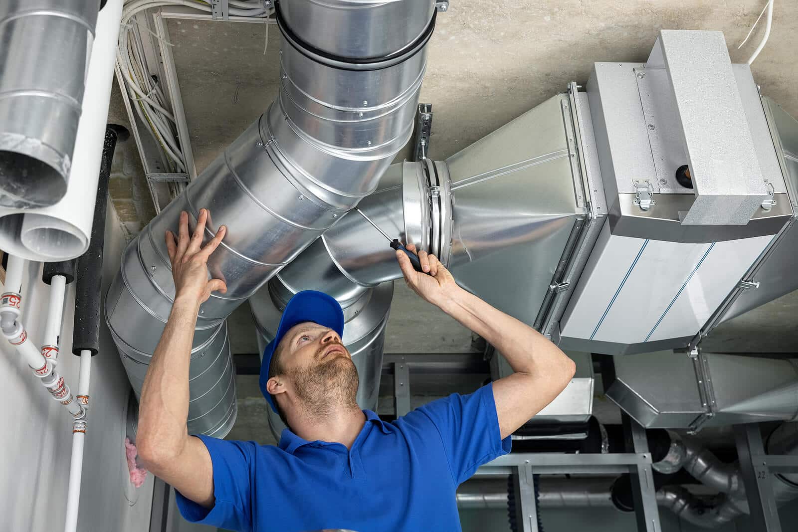 HVAC technician inspecting and repairing air ducts in Rancho Palos Verdes