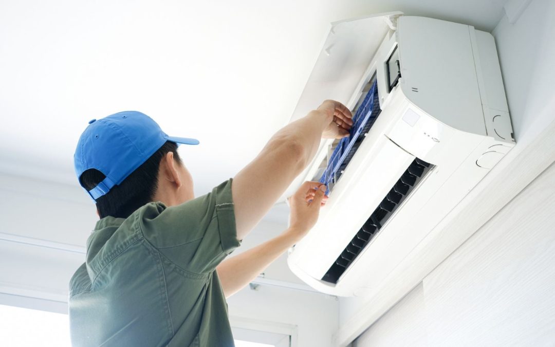 HVAC technician servicing a ductless mini split in Rancho Palos Verdes