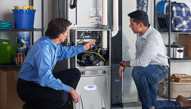 Technician evaluating a furnace for repair or replacement in Rancho Palos Verdes