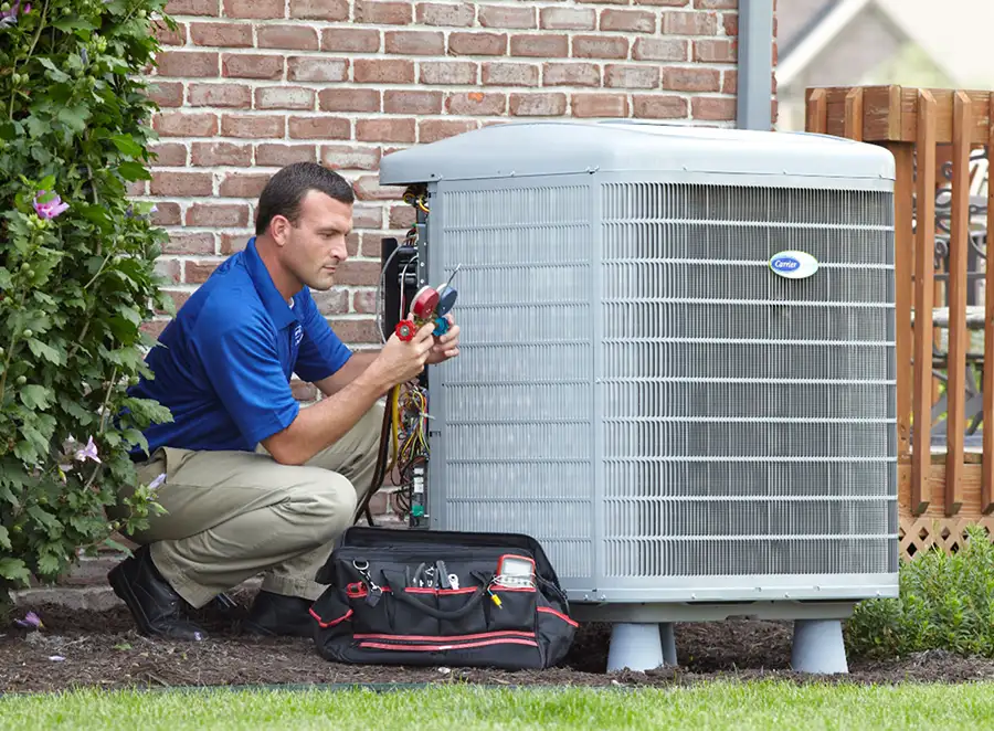 HVAC technician inspecting an outdoor AC unit in Rancho Palos Verdes